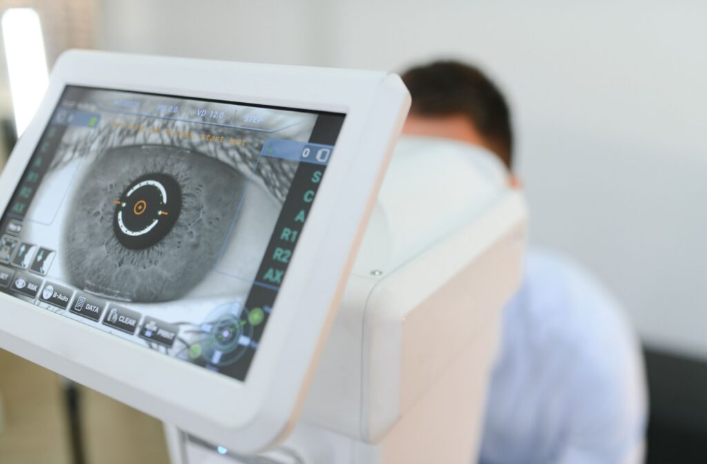 A man using advanced technology to scan his eye during an eye exam
